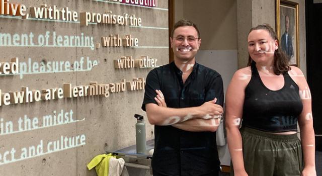 Lorenzo Conte and Kat Brown in front of their installation