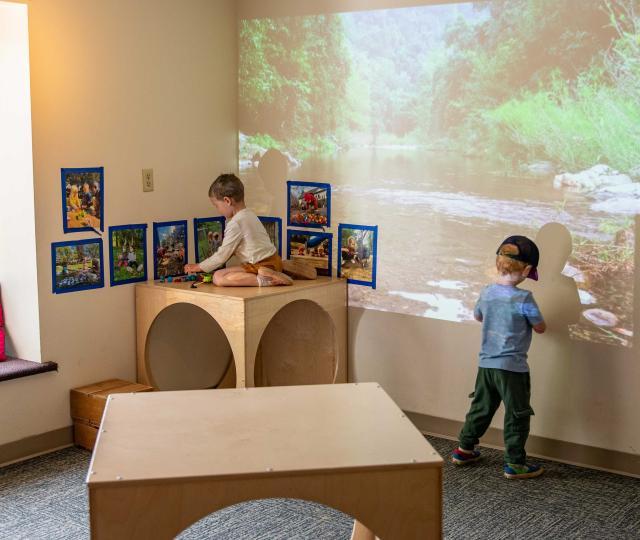 Two kids plat at the Early Learning Center classroom.