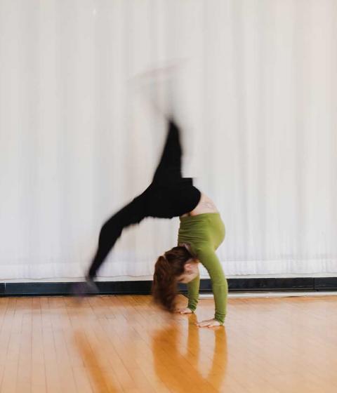 Student dancing in classroom.