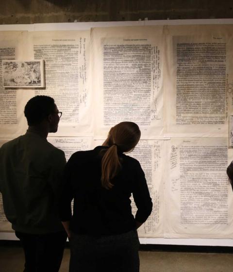 Students study an artwork by Jesse Krimes as part of a class visit during the 'Made in America' exhibition.