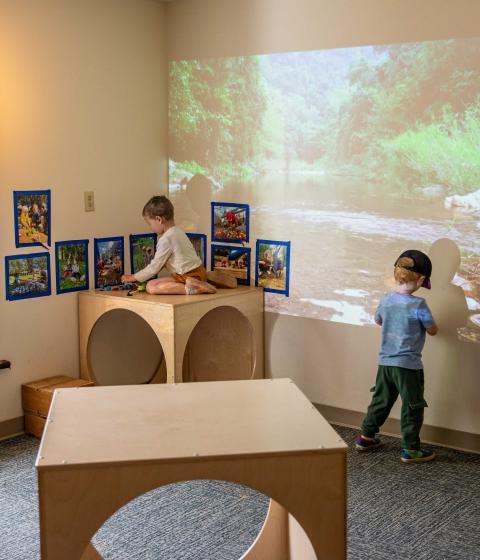 Two kids plat at the Early Learning Center classroom.