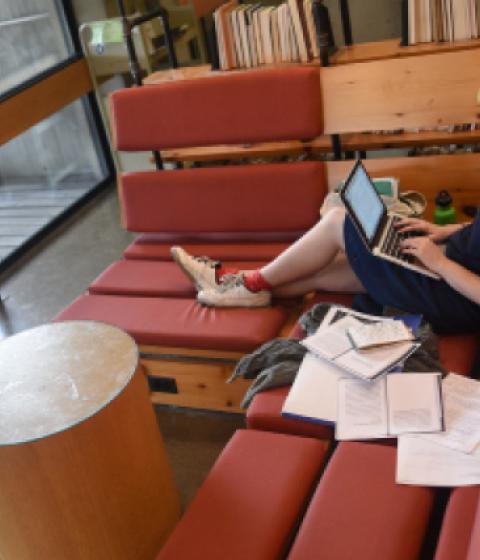 student in Hampshire College library